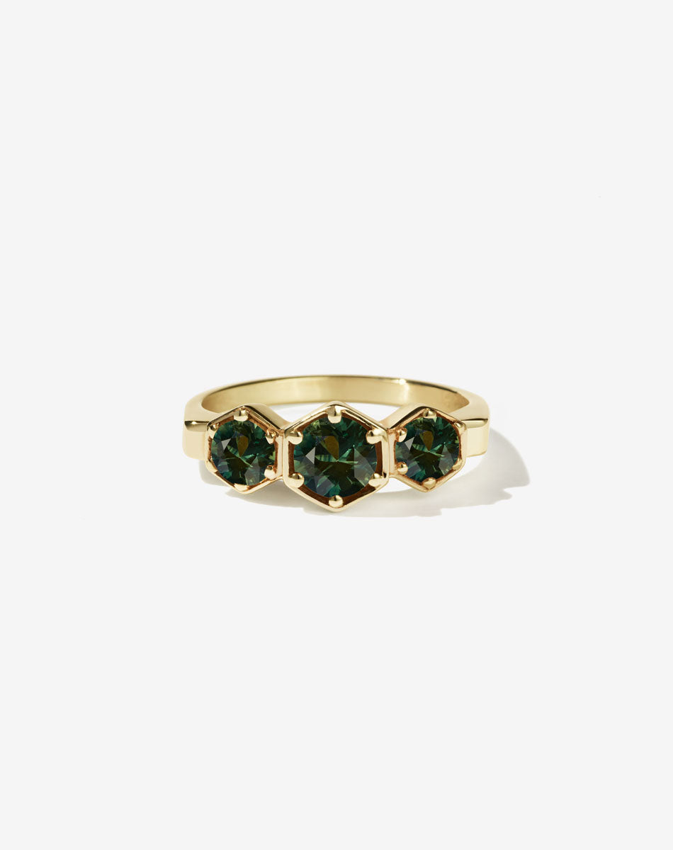 Meadowlark Jewellery’s classic 3 Hexagon Stone Engagement Ring in 18ct Yellow Gold, claw set with round brilliant cut green sapphires. Fully traceable and ethically sourced blue and green sapphires from Queensland, Australia. A bold and beloved 3 stone ring, this Ceremonial design is made to order in New Zealand. 