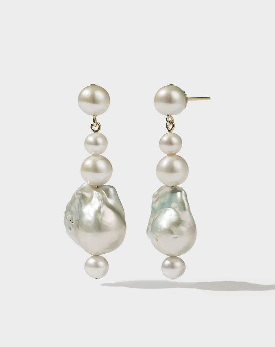 Gold drop earrings featuring a series of round and baroque freshwater pearls.
