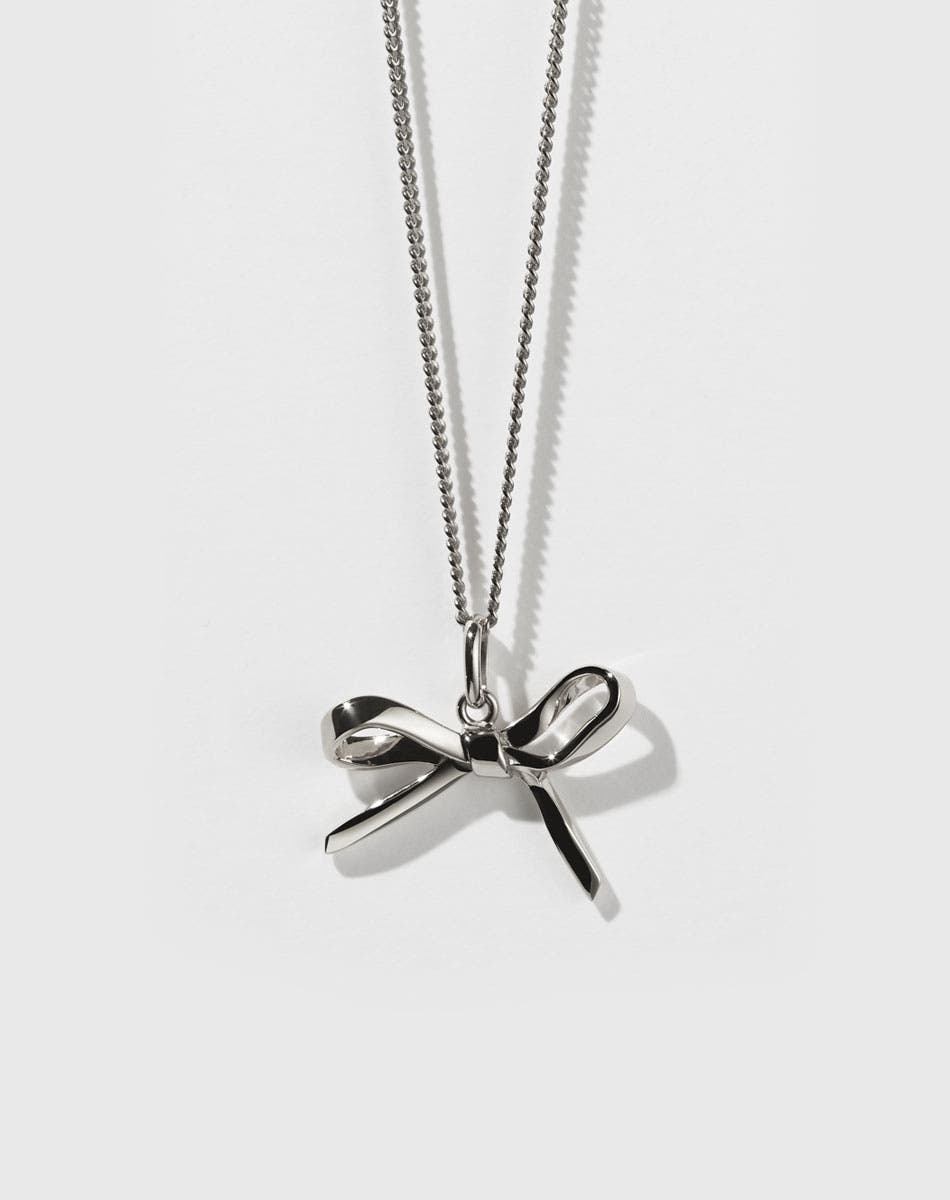 Sterling silver bow charm necklace with a fine chain