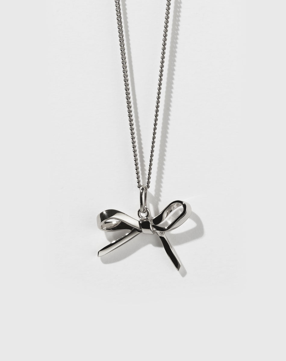 Sterling silver bow charm necklace with a fine chain