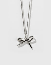Sterling silver bow charm necklace with a fine chain