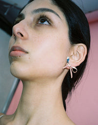 Large Silver Bow Statement Earrings worn on model