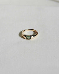 Claude Platinum Ring with oval stone in Swiss setting, minimalist design detail.