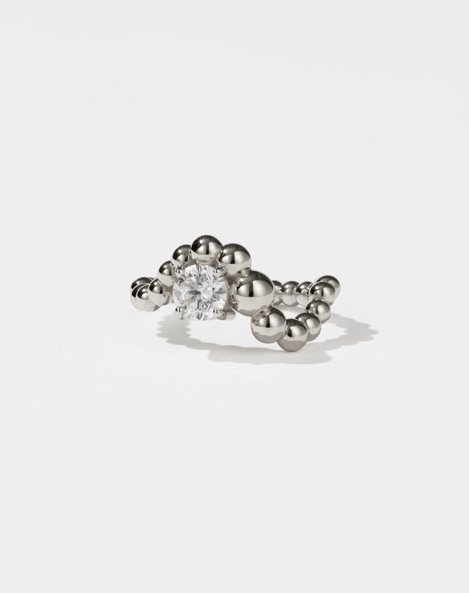 Meadowlark Jewellery’s unique Fizzy Ring Petite Solitaire Engagement Ring in Platinum, with 0.84ct round brilliant cut white diamond. An alternative Ceremonial design to celebrate love, made to order in New Zealand.