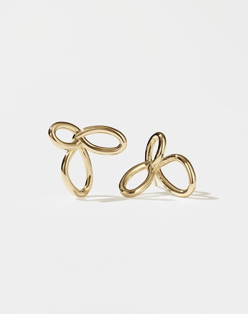 Gold flower earrings in a modern looped style