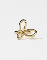 A gold  ring with a flower-like design