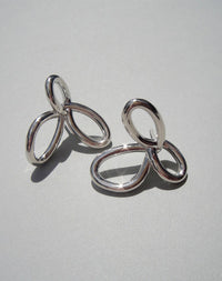 Silver flower earrings in a modern looping style