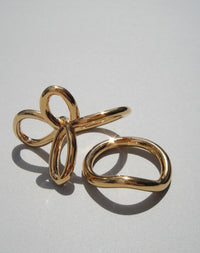 Gold flower ring and curved band