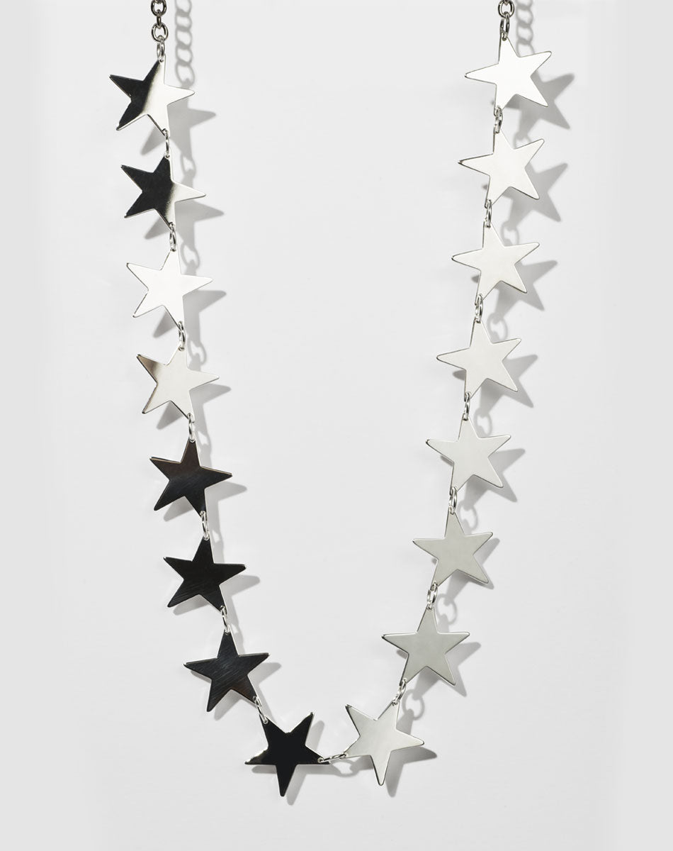 A sterling silver necklace with a series of star-shaped charms linked together.