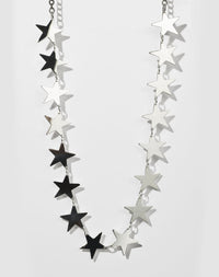 A sterling silver necklace with a series of star-shaped charms linked together.