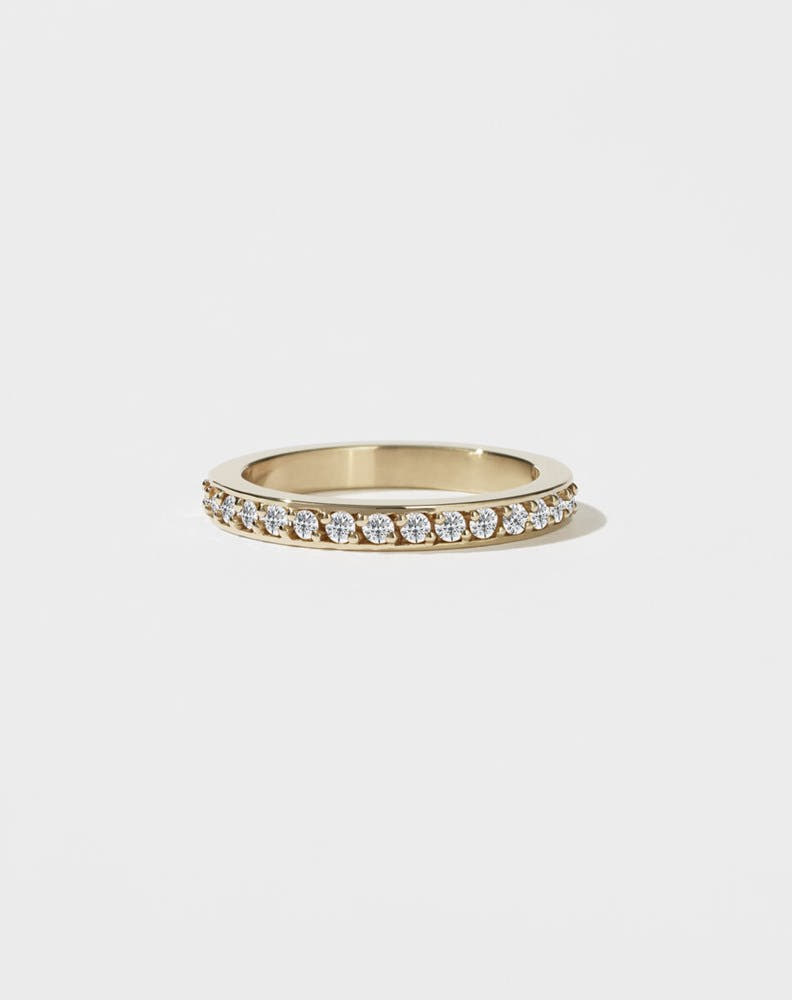 A square-shaped, chunky wedding band in 9ct yellow gold, set with small round brilliant diamonds.
