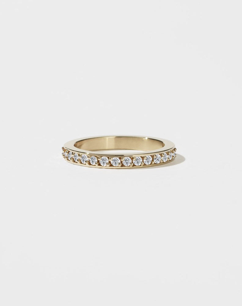 A square-shaped, chunky wedding band in 9ct yellow gold, set with small round brilliant diamonds.