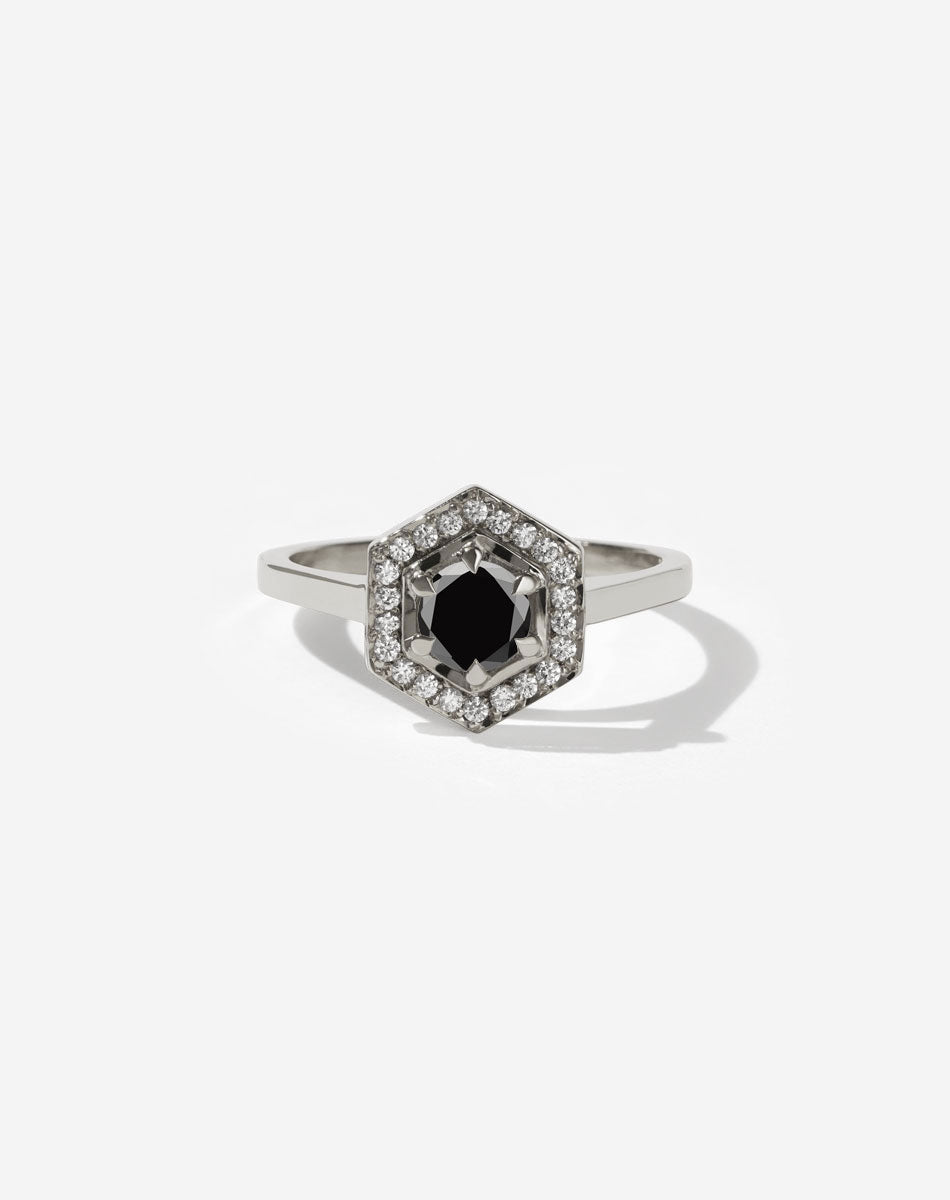 Meadowlark Jewellery’s iconic Hex Engagement Ring 0.5ct in 14ct White Gold, claw set with 0.61ct round brilliant cut black diamond centre stone, surrounded by a hexagon halo of pave set white diamonds. One of our most beloved and modern Ceremonial designs, made to order in New Zealand. Pair with our bestseller, the Diamond Eternity Band.