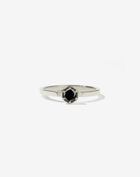 Meadowlark Jewellery’s classic Hexagon Solitaire Engagement Ring in 14ct White Gold, claw set with a 0.25ct round brilliant cut black diamond atop a fine square band. A minimalist, yet bold Ceremonial design made to order in New Zealand.