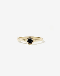 Meadowlark Jewellery’s classic Hexagon Solitaire Engagement Ring in 14ct Yellow Gold, claw set with a 0.25ct round brilliant cut black diamond atop a fine square band. A minimalist, yet bold Ceremonial design made to order in New Zealand.