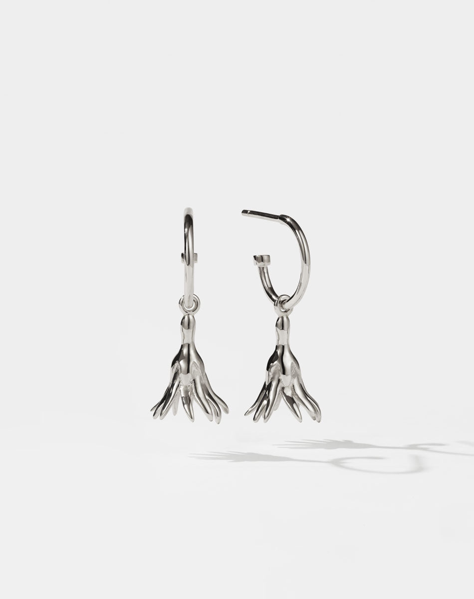 Meadowlark Jewellery’s timeless, everyday Magda Signature Hoop Earrings in Sterling Silver. An enchanting, bell-shaped flower charm suspended from classic signature hoops. From the Dreams collection.