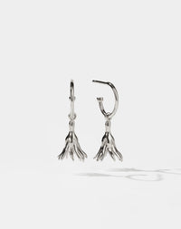 Meadowlark Jewellery’s timeless, everyday Magda Signature Hoop Earrings in Sterling Silver. An enchanting, bell-shaped flower charm suspended from classic signature hoops. From the Dreams collection.