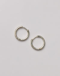 Pair of sterling silver hoop huggie earrings 