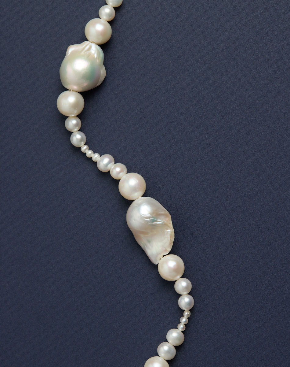 Close up of a necklace with round and baroque pearls. 