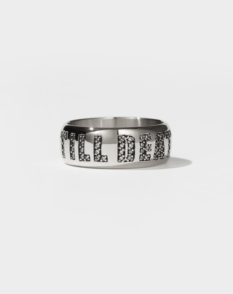 A platinum band ring with the phrase 'Till Death' engraved on it, set with diamonds.