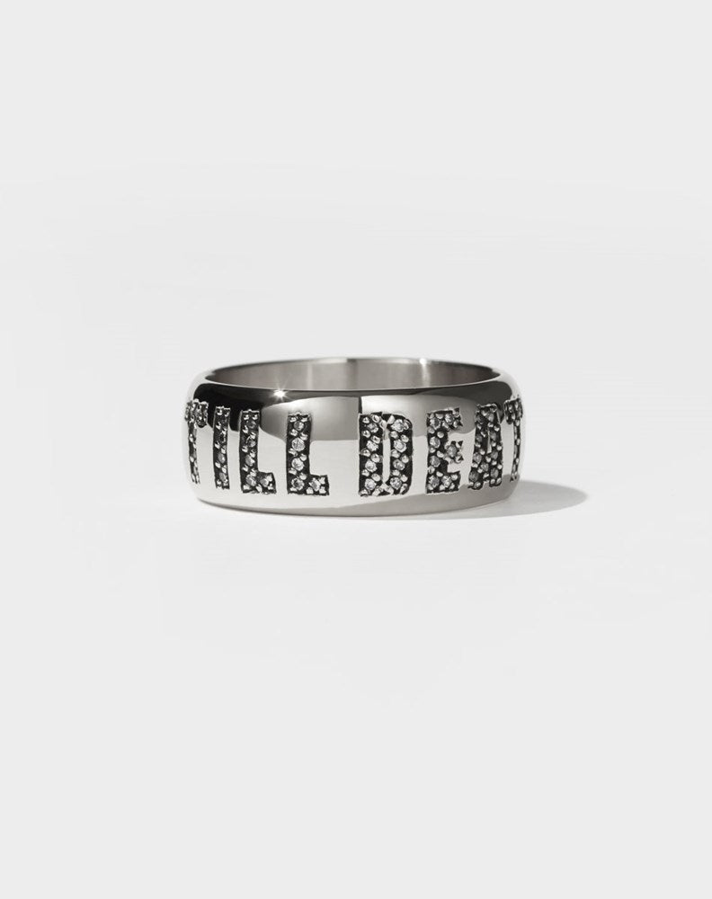 A platinum band ring with the phrase 'Till Death' engraved on it, set with diamonds.