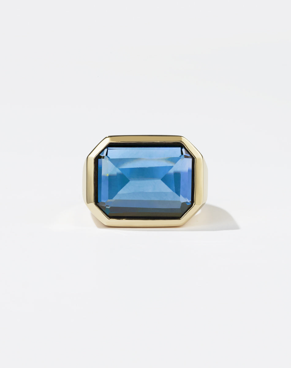 Meadowlark Jewellery's bold Limited Edition Milan Cocktail Ring in 9ct Yellow Gold, bezel set with an emerald-cut blue topaz stone. A classic and timeless design, to celebrate milestones or bring decadence to everyday. Made to order in New Zealand, at the Meadowlark workshop. A bolder version of our Milan Ring.