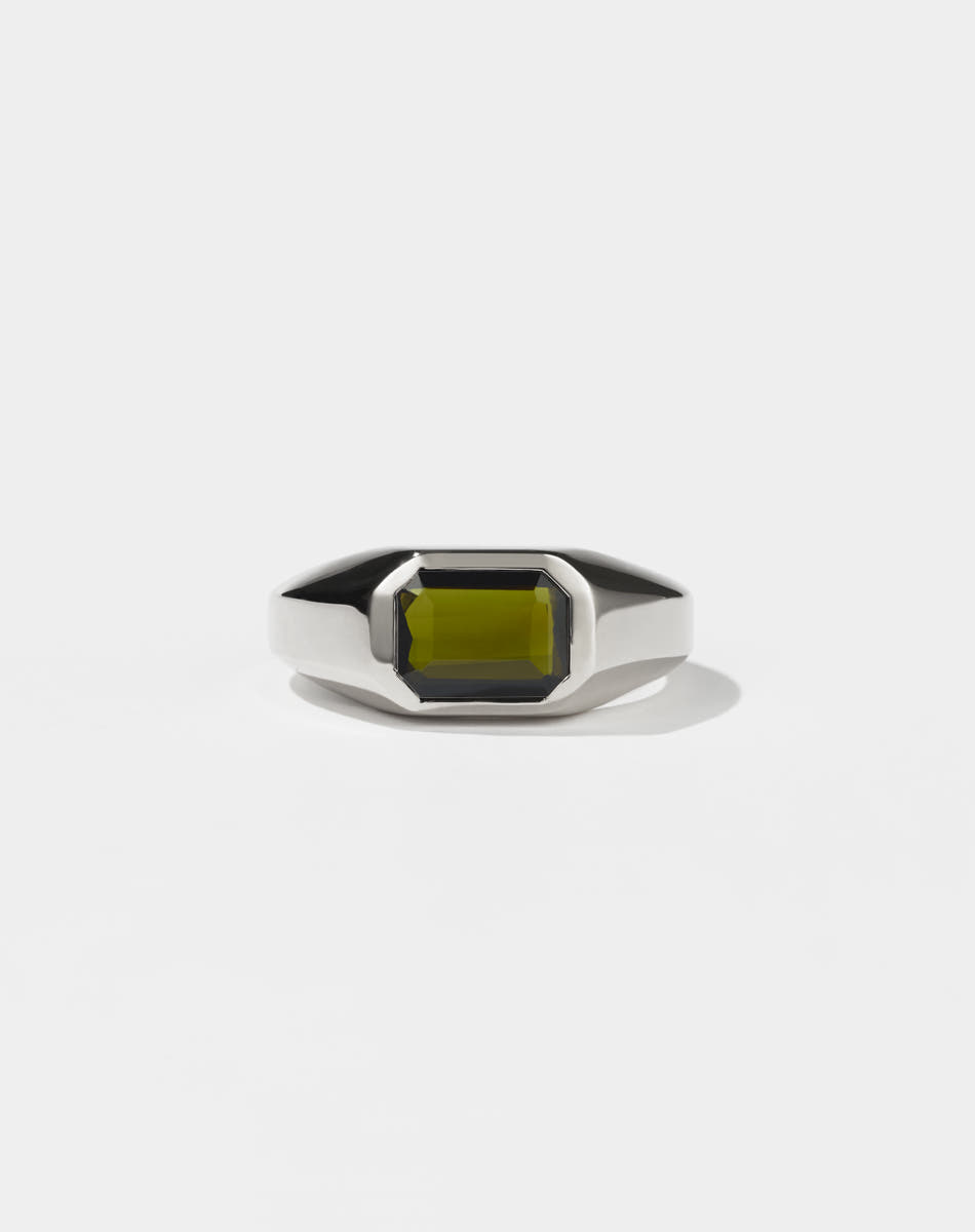 A sterling silver ring with a Green Tourmaline gemstone on a white background. Made by Meadowlark Jewellery in New Zealand.
