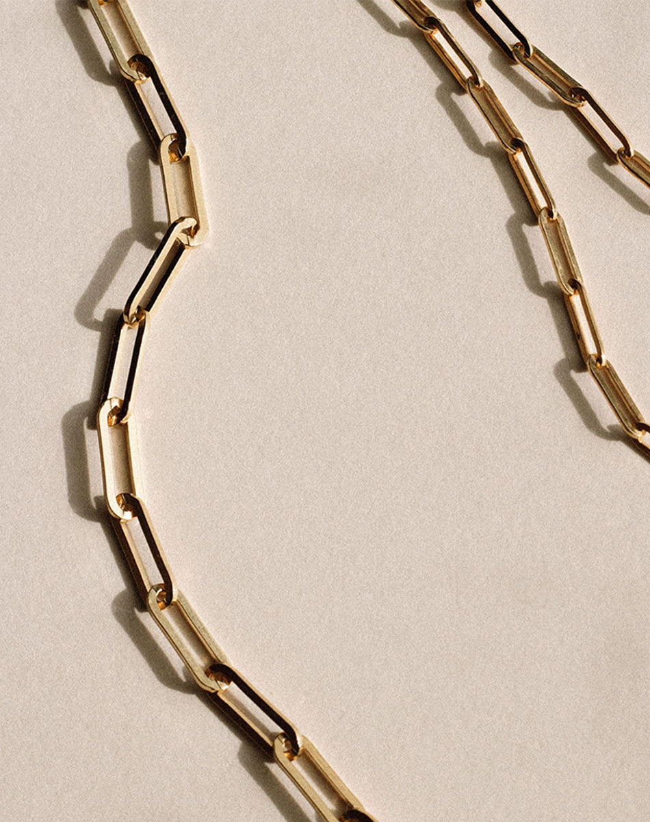 Gold paperclip chain necklaces.