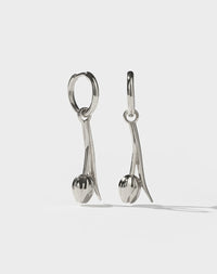 Pair of silver tulip motif earrings on a white background