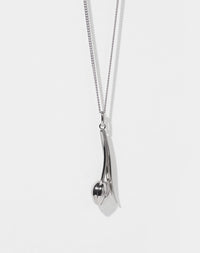 Silver tulip motif pendant necklace on a white background