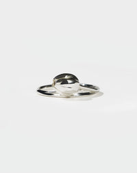 Silver tulip motif ring on a white background