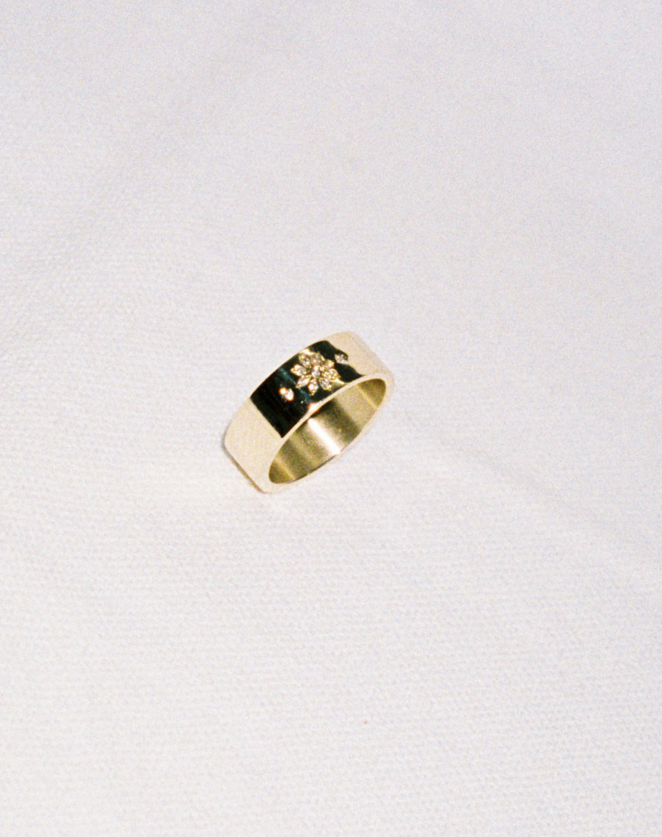 Violet Ring with floral engraving in 9ct Yellow Gold. Set with round brilliant cut 
 White Diamond. 6.4mm width wedding band.