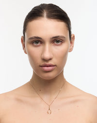 Gold Wishbone Charm Necklace on Model