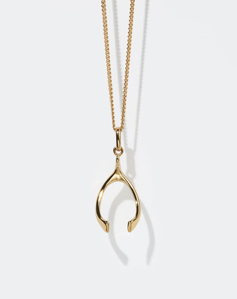Gold wishbone charm necklace