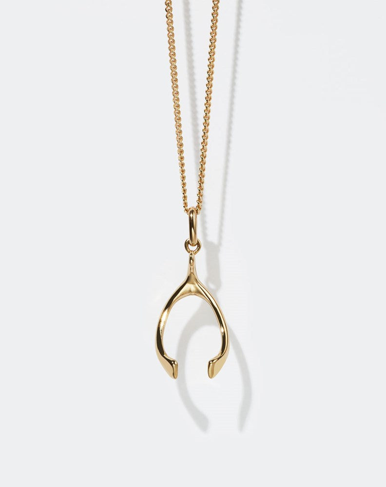 Gold wishbone charm necklace