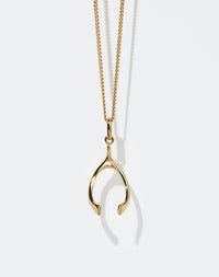 Gold wishbone charm necklace