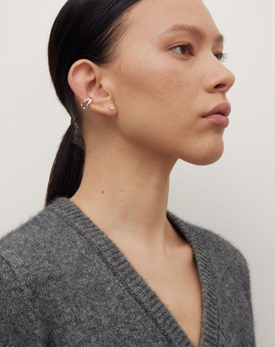 Coco Ear Cuff Small in Sterling Silver, featuring a double loop. Inner diameter approximately 7.5mm. Worn on model with Lulu Stud Earring in 23k Gold Plated or 9ct Yellow Gold.