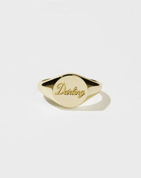 A 9ct solid gold signet ring with the word Darling engraved on the top surface