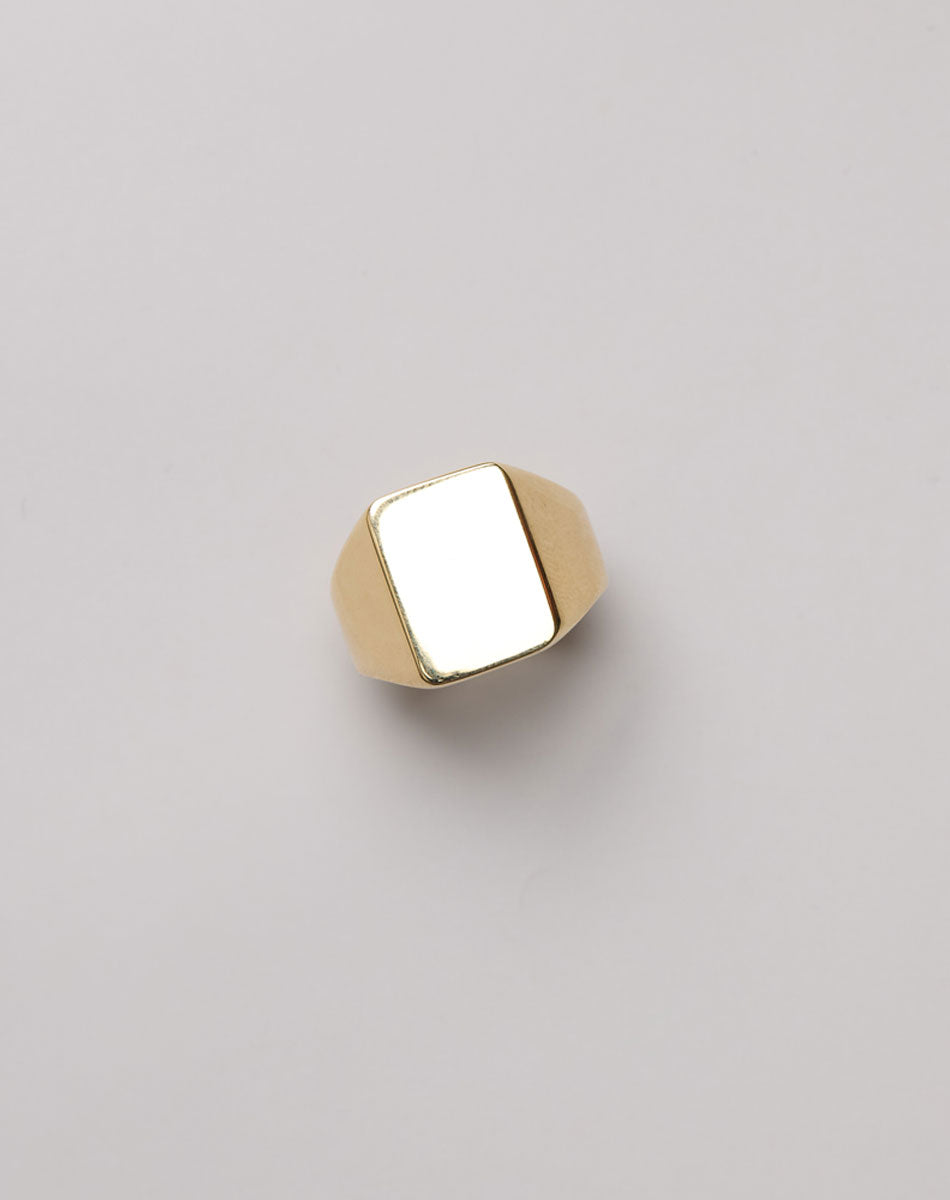 Gold signet ring with a large rectangle face 