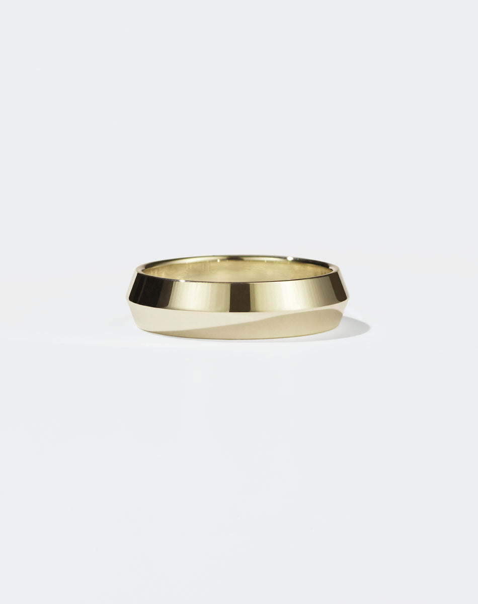 Meadowlark Jewellery's classic 6mm wide Knife Edge Band in 14ct Yello Gold. Designed for everyday or as a men's wedding band. Made to order in Auckland, New Zealand. 