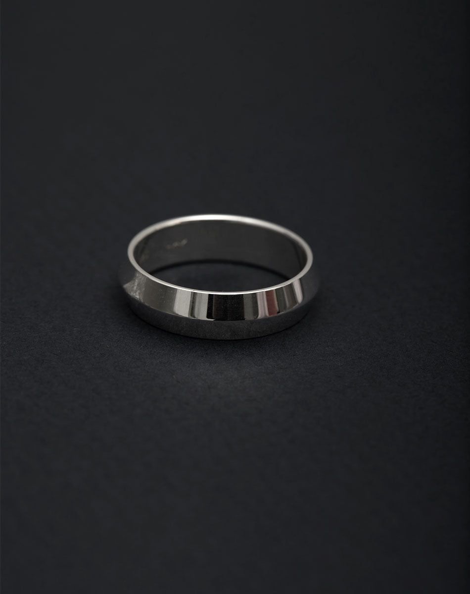Meadowlark Jewellery's classic 6mm wide Knife Edge Band in Sterling Silver. Designed for everyday or as a men's wedding band. Made to order in Auckland, New Zealand. 