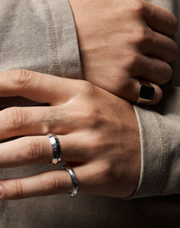 Meadowlark Jewellery's classic 6mm wide Knife Edge Band in Sterling Silver. Designed for everyday or as a men's wedding band. Made to order in Auckland, New Zealand. Worn on model.