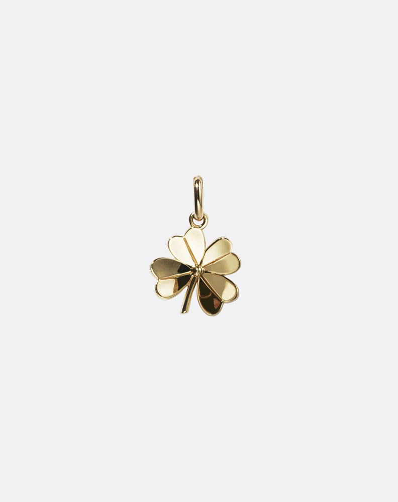 Gold four-leaf clover pendant on a white background
