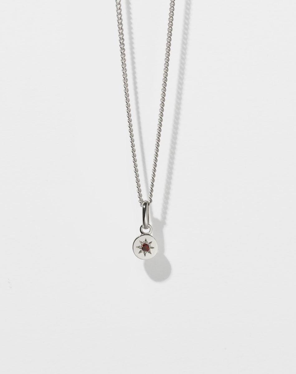 Lulu Necklace in Sterling Silver with star set African Garnet. 6mm diameter pendant on 40cm or 45cm diamond curb chain.