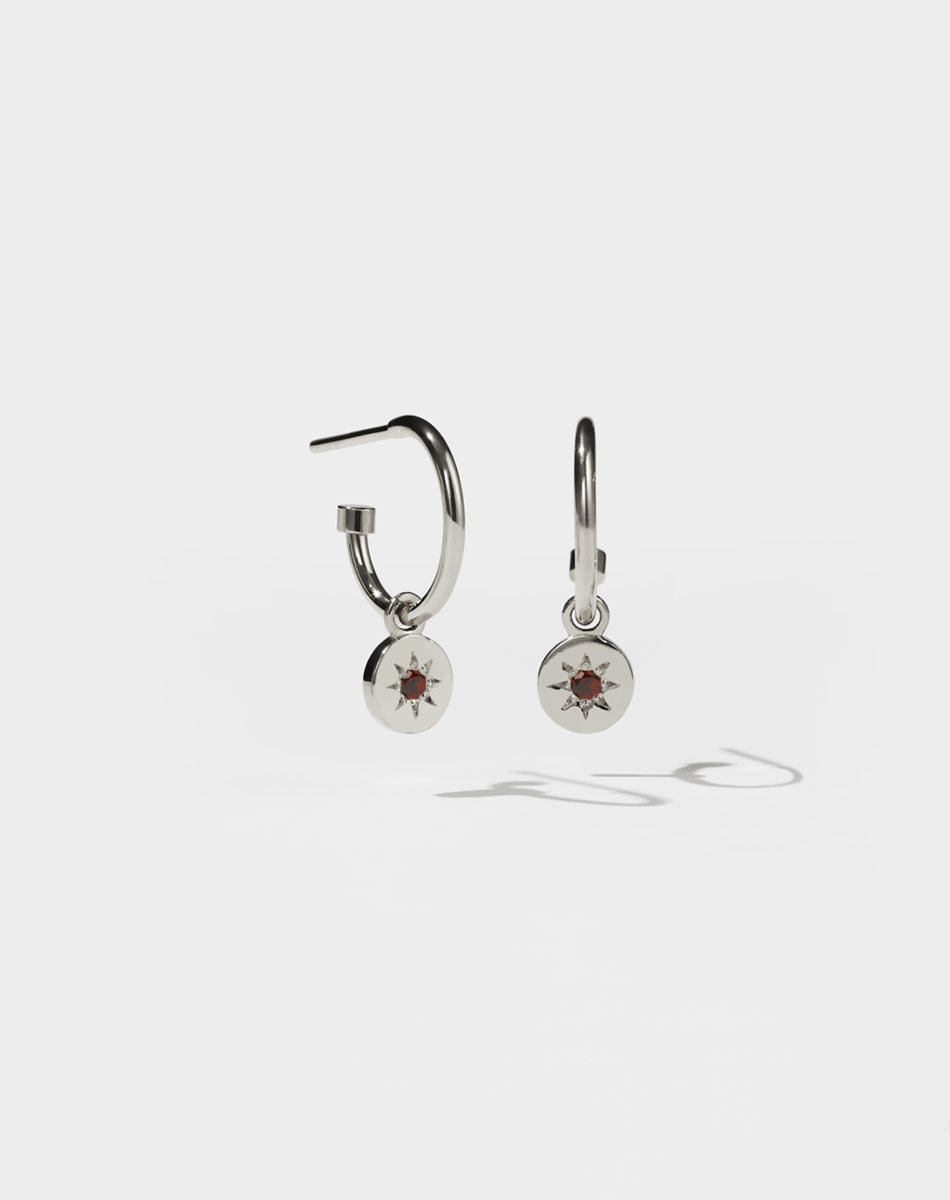 Lulu Signature Hoop Earrings in Sterling Silver with star set African Garnet. 6mm in diameter.