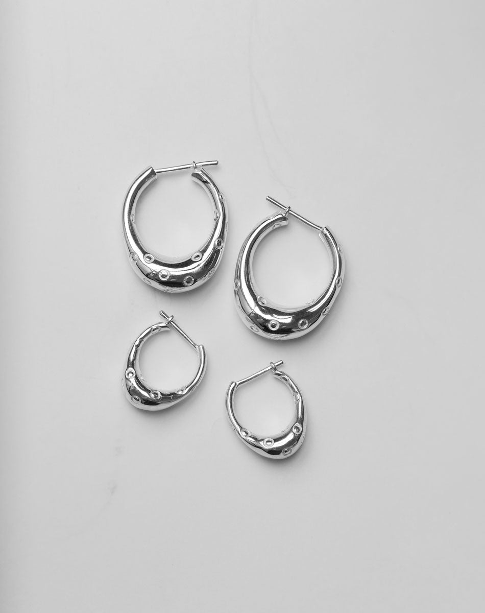 Silver hoop earrings in large and small sizes with circle engravings, inspired by Strawberries.
