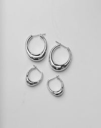 Silver hoop earrings in large and small sizes with circle engravings, inspired by Strawberries.