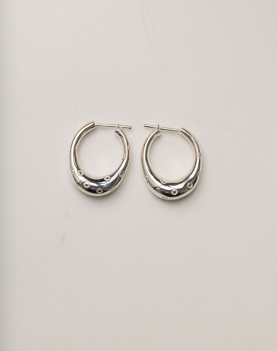 Pair of silver hoop earrings with circle engravings, inspired by Strawberries.
