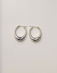 Pair of silver hoop earrings with circle engravings, inspired by Strawberries.