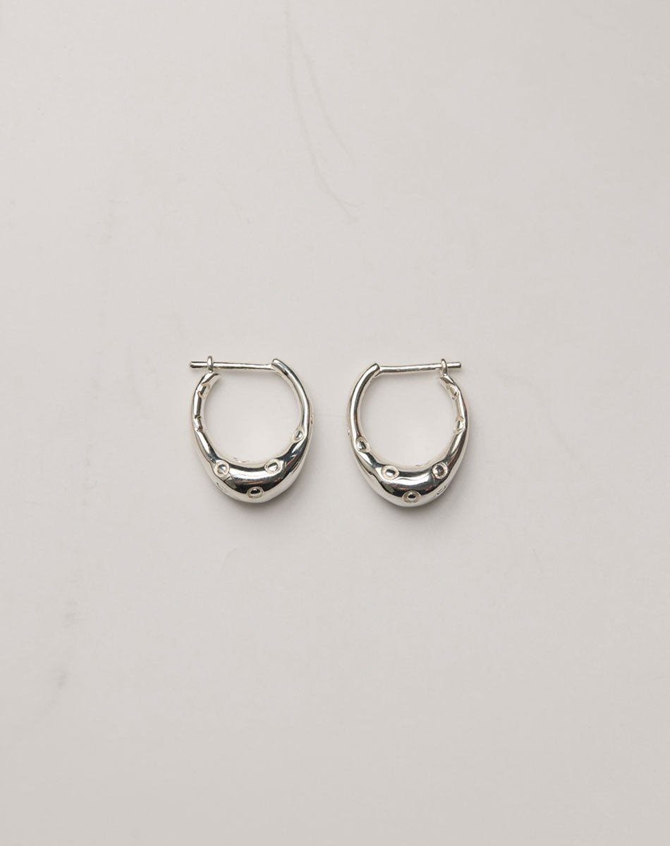 Pair of silver hoop earrings with circle engravings, inspired by Strawberries.